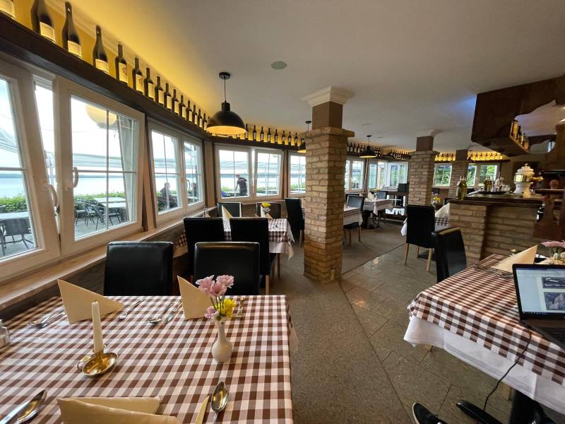 Dining room with pendant lights and a view of the lake