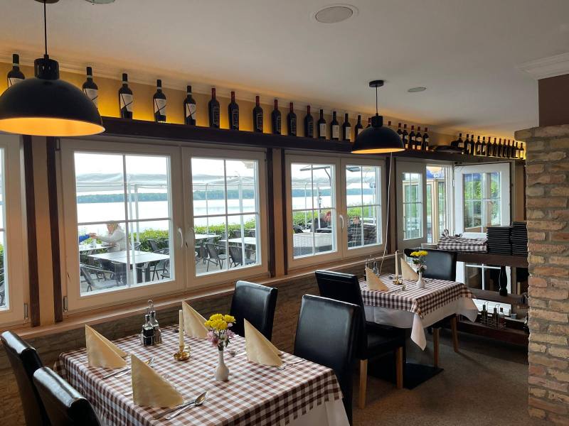 Dining room with wine rack and checked tablecloths