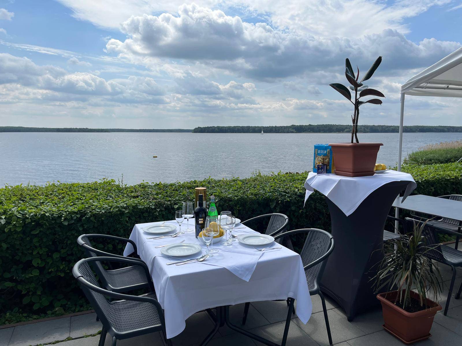 Laid table on the terrace overlooking Lake Senftenberg