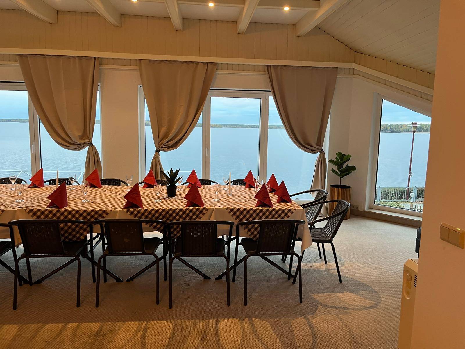 Dining room with large windows facing the lake